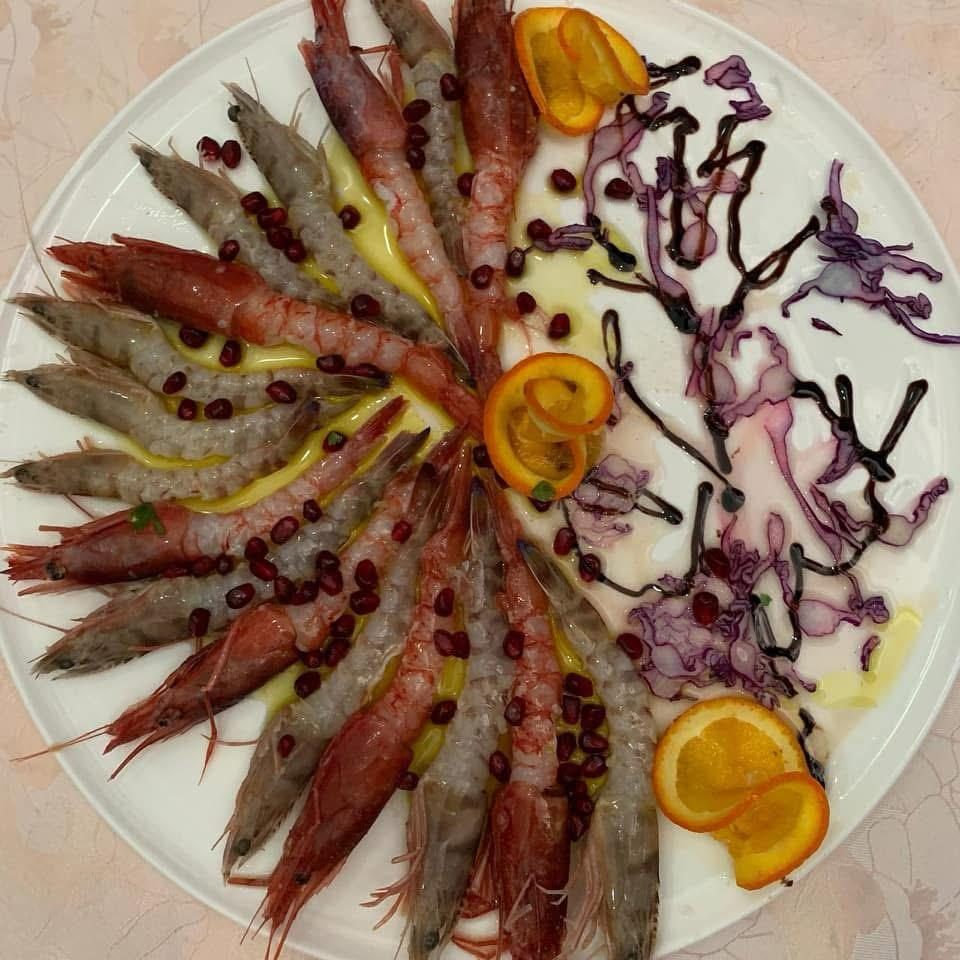 Red prawn carpaccio with orange